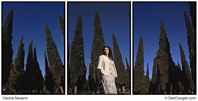 Cecilia Navarro among cypress trees