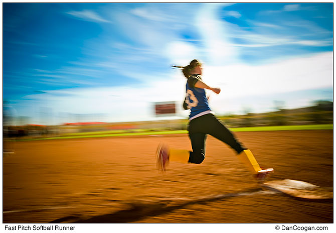 Fast Pitch Softball Runner about to touch first base.