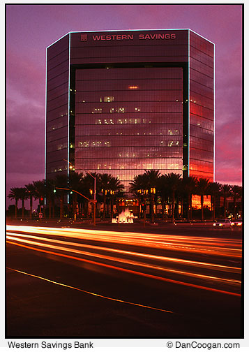 Western Savings Bank at dusk with traffic