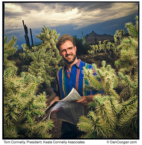 Tom Connelly, President, Keats Connelly Associates, among the cholla plants in the desert, Phoenix, AZ