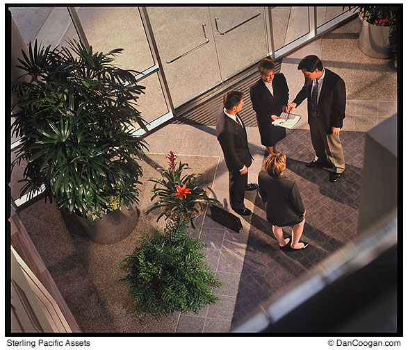 Sterling Pacific Assets, overview of four people meeting in the lobby